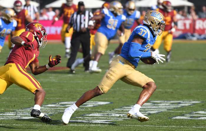 UCLA defensive back Quentin Lake (37) intercepts a pass intended for Southern Cal receiver Gary Bryant Jr. (1). Mandatory Credit: Richard Mackson-USA TODAY